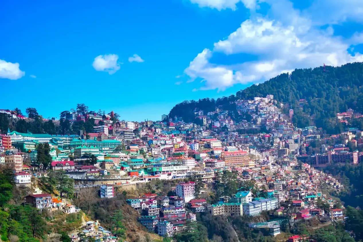 Shimla hillside buildings and surrounding mountains